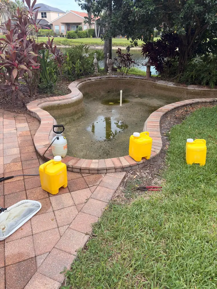 The pool during restoration, with cleaning supplies