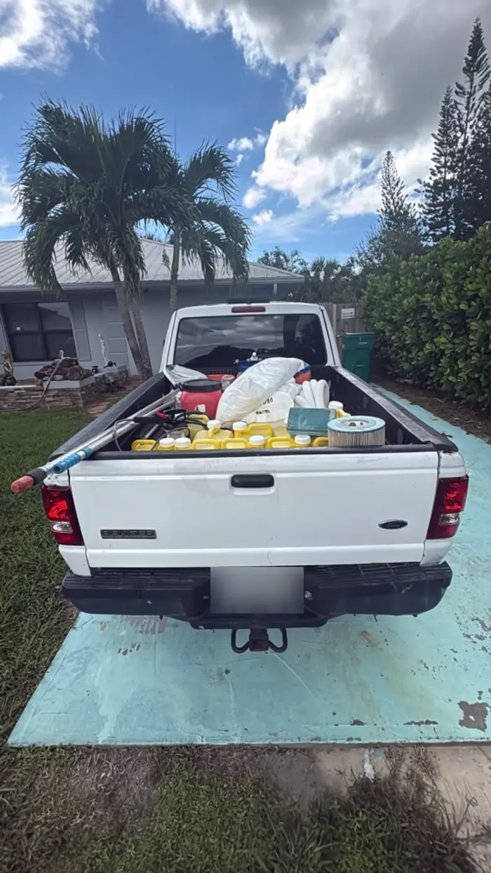 Work truck loaded with pool cleaning equipment